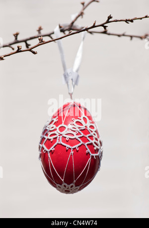Hand-painted egg shell hanging from a branch to celebrate Easter at the Old Vienna Easter Market at the Freyung, Vienna. Stock Photo
