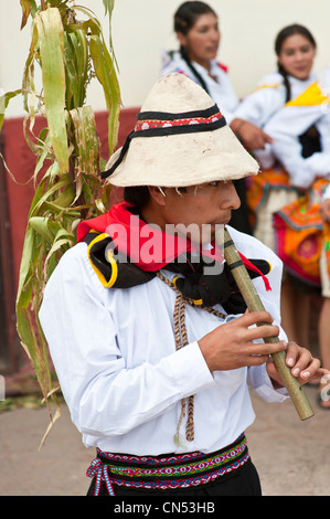 Peru, Cuzco Province, Huaro, young playing flute in traditional dress for the corn feast, Sara Raymi Stock Photo
