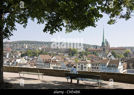 Horizontal wide angle of the view from Lindenhof hill with Predigerkirche, Preachers Church spire prominent on the skyline. Stock Photo