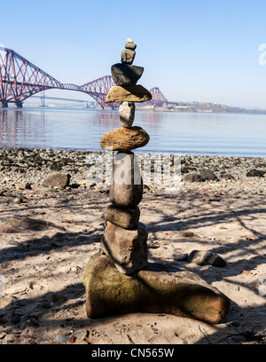 Stones balanced one on top of the other to form a towering stack, Queensferry, West Lothian, Scotland. Stock Photo
