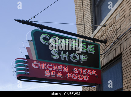 A vintage coffee shop neon sign advertising menu items of chicken, steak, and seafood at the historic site of the Lorraine Hotel Stock Photo