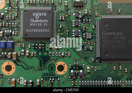 Close up computer circuit hard drive, printed circuit board, electronic components, integrated circuit surface mount pcb assembly hardware technology Stock Photo
