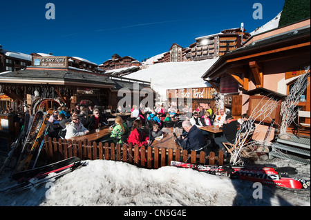 Skiers enjoying après ski outside a mountain restaurant at the Lukova ...