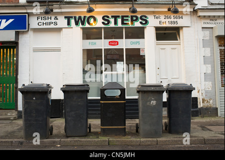 Wheelie bins on the pavement waiting to be emptied Stock Photo