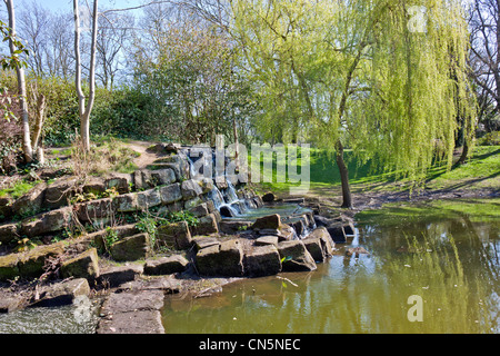 A small waterfall in Hanley park Stoke on Trent Stock Photo