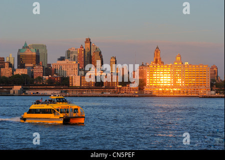 United States, New York, taxi boat in front of Brooklyn skyscrapers Stock Photo