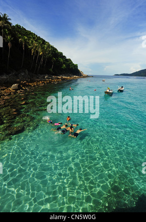 Malaysia, Terengganu State, Perhentian Islands, Perhentian Kecil, tourists snorkling in turquoise water Stock Photo