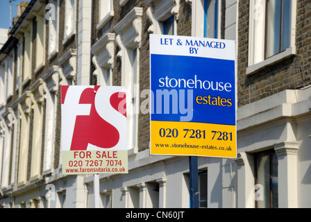 ‘ For Sale ‘ and ‘ Let By ‘ signs outside a group of terraced houses Stock Photo