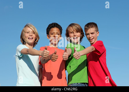 group of divderse kids at summer camp with thumbs up Stock Photo