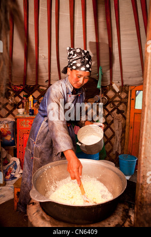 Mongolian house wife make milk tea, Mongolia Stock Photo