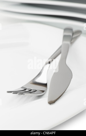 white empty dish, knife and fork Stock Photo
