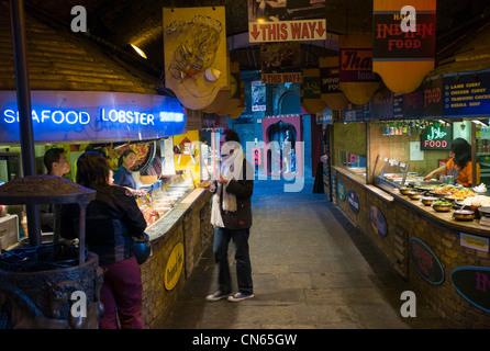 Indoor oriental, continental food stall, Camden Market, Camden Town, London, England Stock Photo