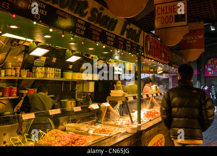 Indoor oriental, continental food stall, Camden Market, Camden Town, London, England Stock Photo