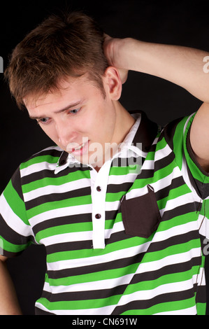 Musing man over black background Stock Photo