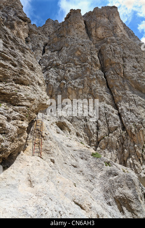 climbing way with metal ladder and steel ropes in Italian Dolomites Stock Photo