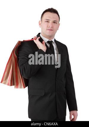 Image of a young businessman with a shopping bag isolated against a white background. Stock Photo
