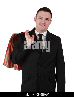 Image of a smiling young businessman with a shopping bag isolated against a white background. Stock Photo