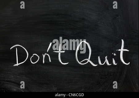 Conceptional chalk drawing - Don't quit Stock Photo