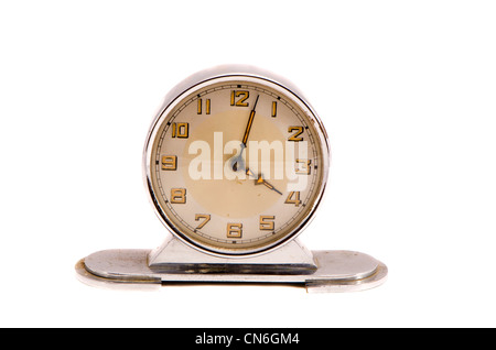 Ancient vintage retro metal clock show few minute past four isolated on white background. Stock Photo