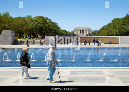 National World War II Memorial with Wall of Stars and Lincoln Memorial behind, Washington D.C, USA