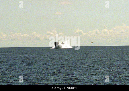 The nuclear-powered attack submarine USS PITTSBURGH (SSN-720) surfaces off the coast of Andros, Bahamas as part of an emergency Stock Photo