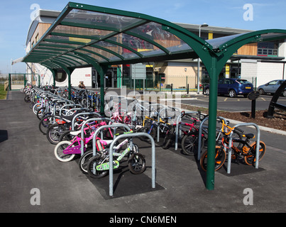 Primary school bike sheds full of children's bicycles, Blyth, Northumberland, England UK Stock Photo