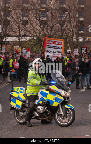 Police motor cyclist leads the Anti Cuts march during the Liberal Democrats conference in Sheffield Stock Photo