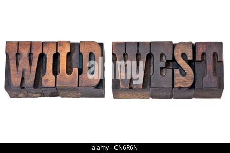 wild west - isolated text in vintage letterpress wood type - French Clarendon font popular in western movies and memorabilia Stock Photo