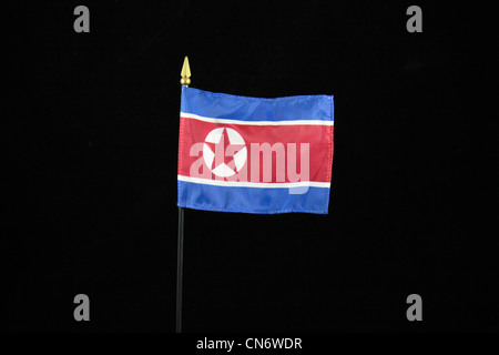 The national flag of North Korea on a black background. Stock Photo