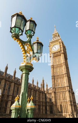 Low angle shot of Big Ben in London, with ornamented lamppost in the foreground. Stock Photo