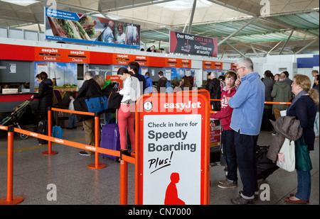 Easyjet baggage Speedy boarding check-in queue, Stansted airport Essex UK Stock Photo