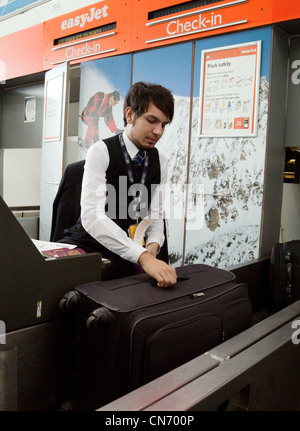 Staff At Airport Check In Desk Handing Ticket To Passenger Stock Photo ...