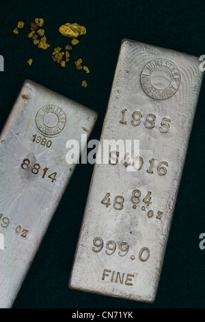 Homestake Mining Company Silver Bullion Bars and Natural Gold Nuggets Stock Photo