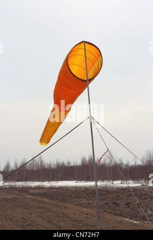 Wind direction Flag on blue cloud sky in wind Stock Photo