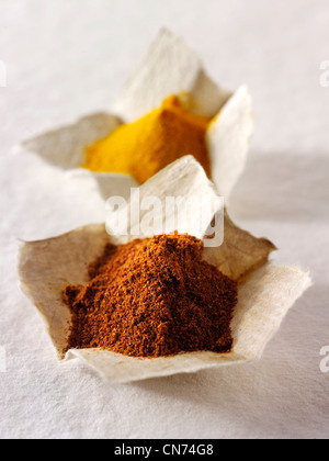 Ground chilli powder spice & ground turmeric composed arrangement Stock Photo