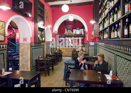 Interior of a traditional local tapas bar in the historic Jewish quarter (Barrio Santa Cruz), Sevilla, Andalucia, Spain Stock Photo