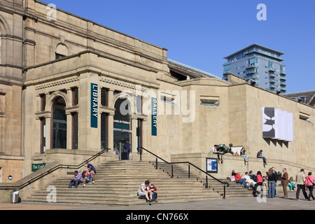 Scene with people on steps outside city public Central Library and Art Gallery in The Headrow Leeds West Yorkshire England UK Stock Photo