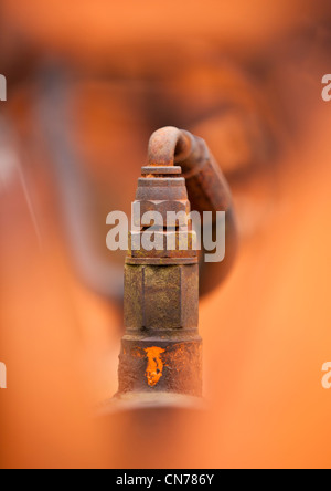 Old hydraulic connector on abandoned farm machine in Shropshire Stock Photo