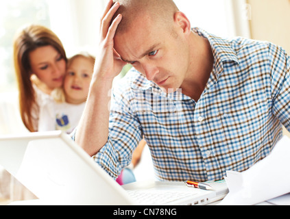 Couple working out finances Stock Photo