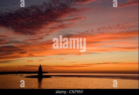 Lighthouse at Orient Point in the evening sunset, Long Island Sound, New York State, United States of America Stock Photo
