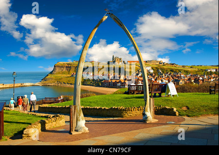 Whale Bone arch overlooking Whitby harbour with Whitby Abbey on the headland . Whitby, North Yorkshire, England Stock Photo