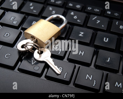 Keys and padlock on the computer keyboard as a data security concept. Stock Photo