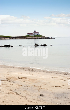 Watch Hill Rhode Island beach with the historic lighthouse landmark in the distance. Stock Photo
