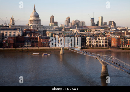 Thames with St Pauls and the Millenium footbridge with the thames shoreline and London Skyline Stock Photo