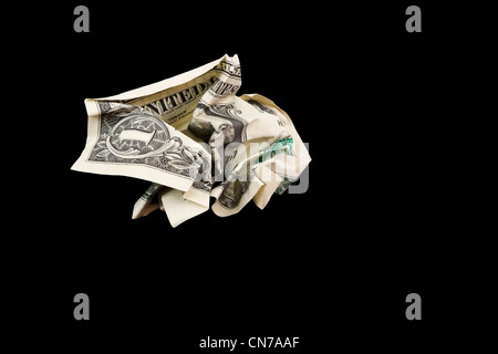 Crumpled one dollar bill isolated on black Background. Stock Photo