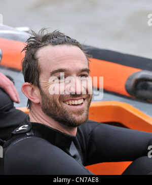 Protester against elitism Trenton Oldfield in RNLI rib looking smug after stopping the 158 th Oxford verses Cambridge Boat Race Stock Photo