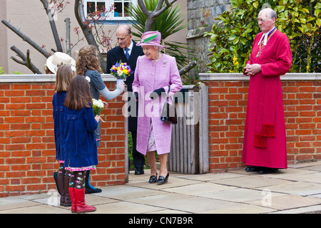Her Majesty Queen Elizabeth II, the Duke of Edinburgh and the Dean of Windsor Rt Rev David Connor on Easter Sunday 2012. PER0151 Stock Photo
