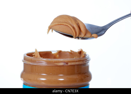 close up of peanut butter jar and spoon Stock Photo