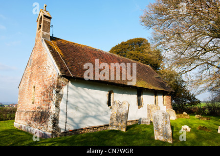 St Andrews Church, Didling, West Sussex as seen from the north side on a fine morning in early Spring with clear blue sky Stock Photo