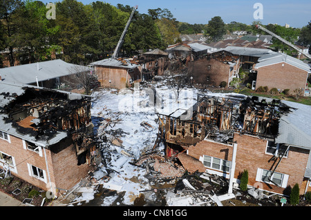 Firefighting foam covers the scene of a crash where a US Navy F-18 aircraft crashed after taking off from Naval Air Station Oceana April 6, 2012 in Virginia Beach, VA. Stock Photo